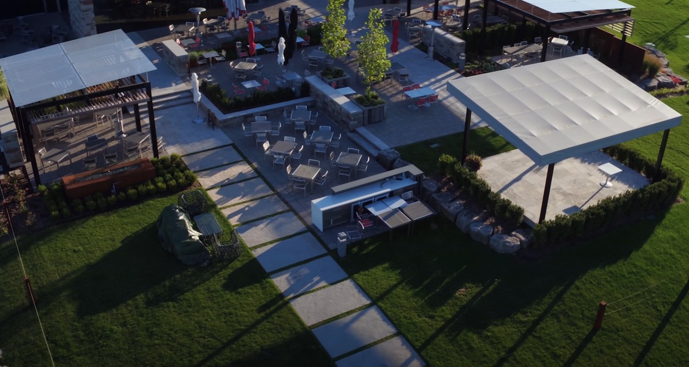 Custom hardscaping patio installation with pavers and outdoor furniture in Rialto CA